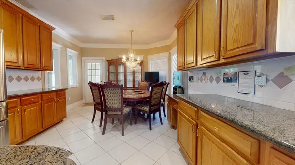a kitchen with stainless steel appliances granite countertop a sink dishwasher and cabinets with wooden floor