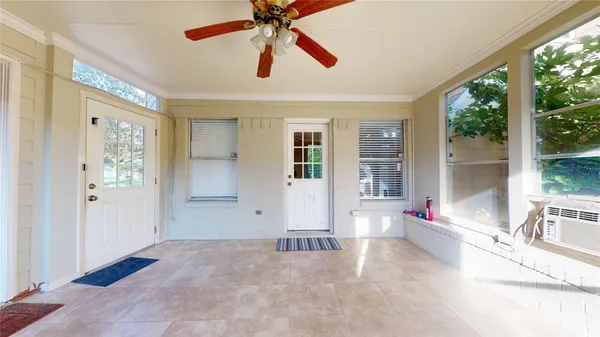 a kitchen with stainless steel appliances granite countertop a refrigerator a stove and a wooden floors