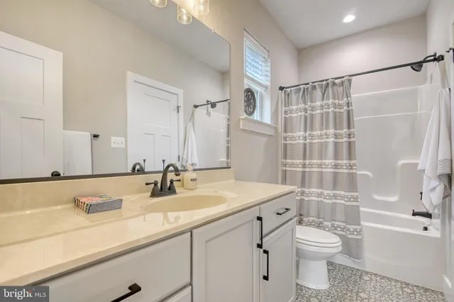 a bathroom with a sink toilet a shower and a bath tub