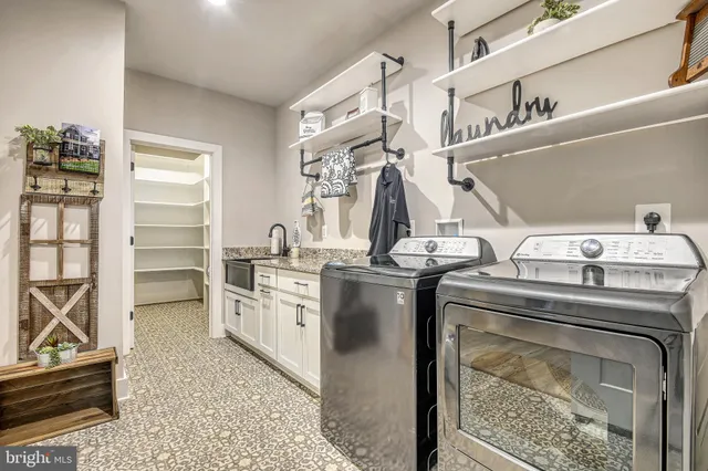 a utility room with washer and dryer