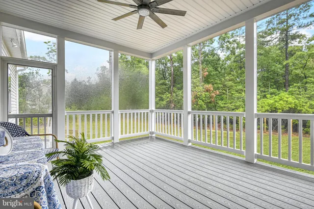 a view of a room with wooden floor and city view