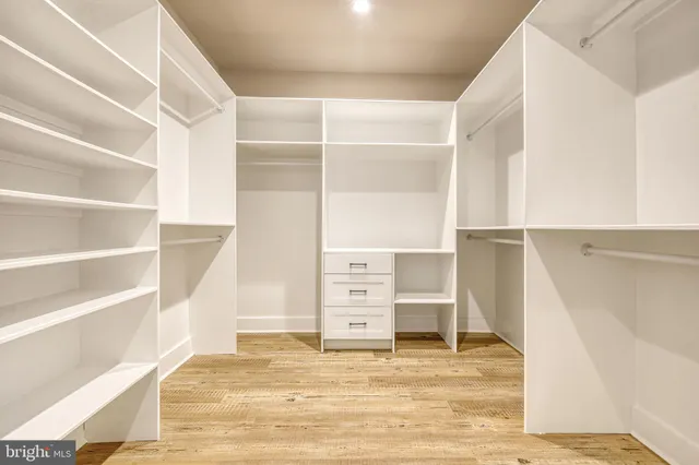 a view of an empty room with empty shelves