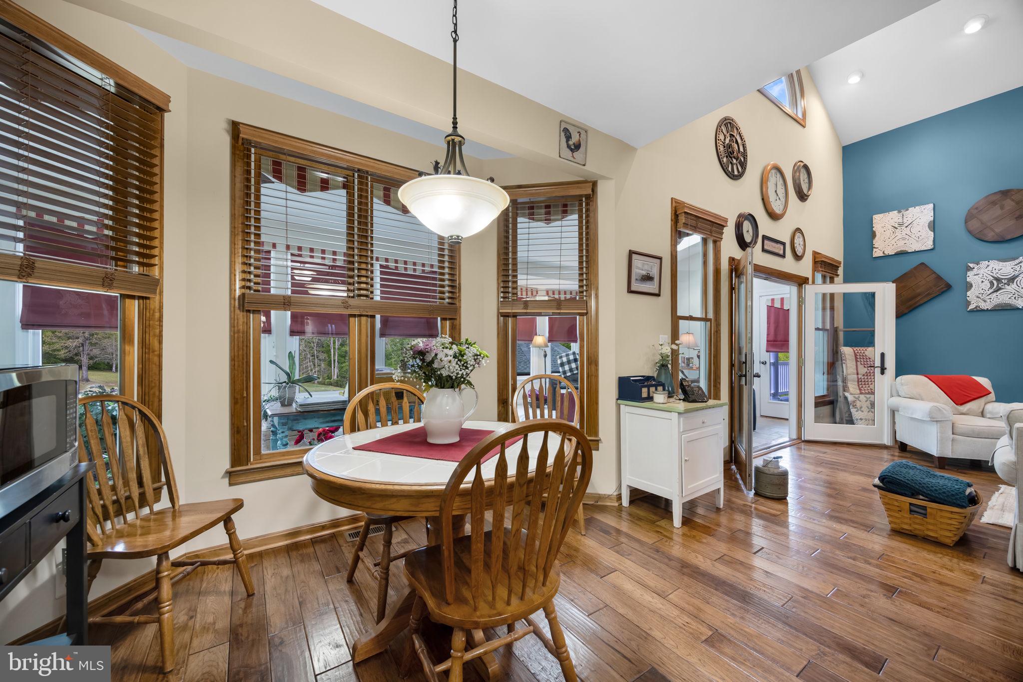 6657 Lawyers Road Spotsylvania, VA 22551 - Photo 14 of 73 a view of a dining room with furniture wooden floor and chandelier