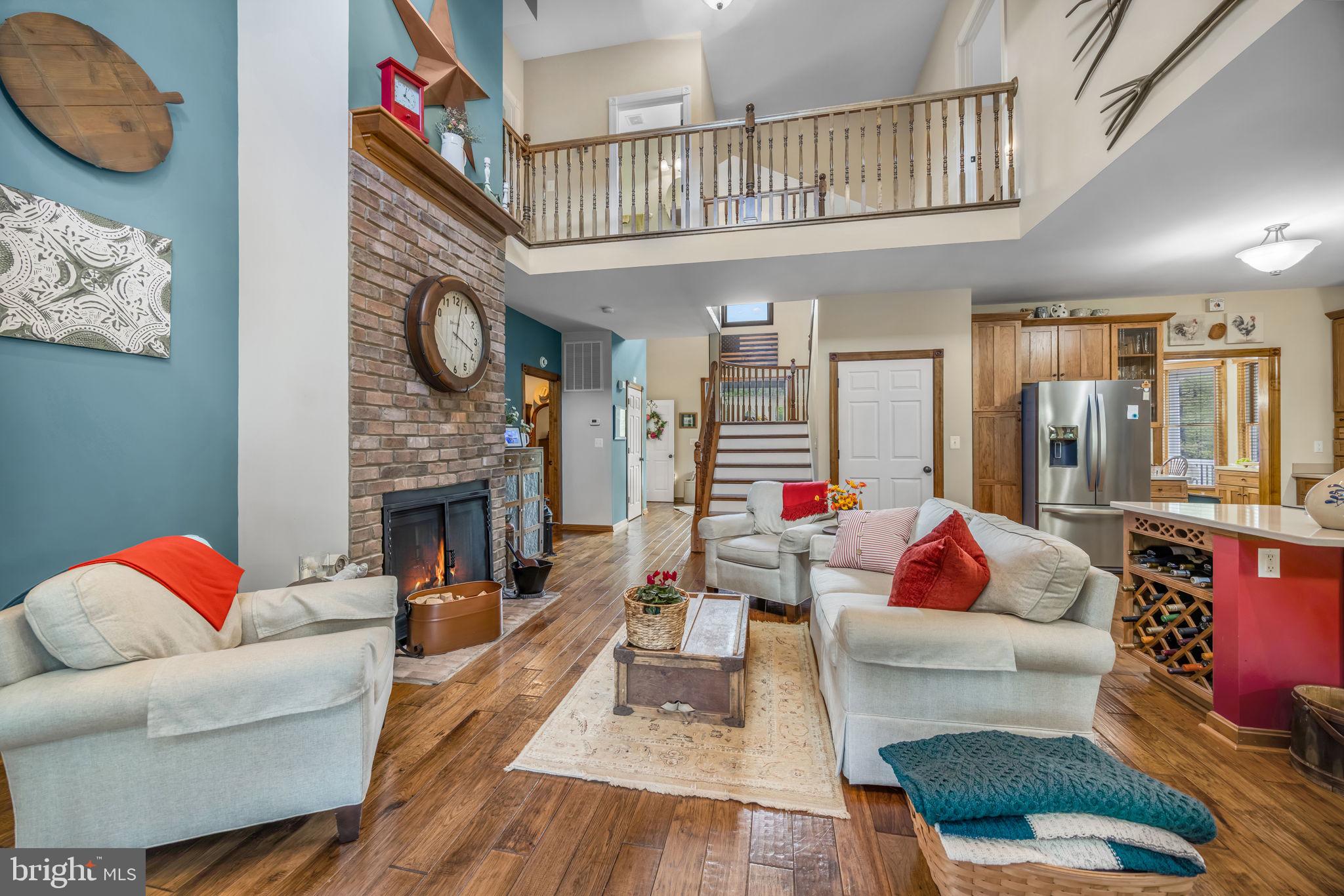 6657 Lawyers Road Spotsylvania, VA 22551 - Photo 17 of 73 a living room with furniture and a fireplace
