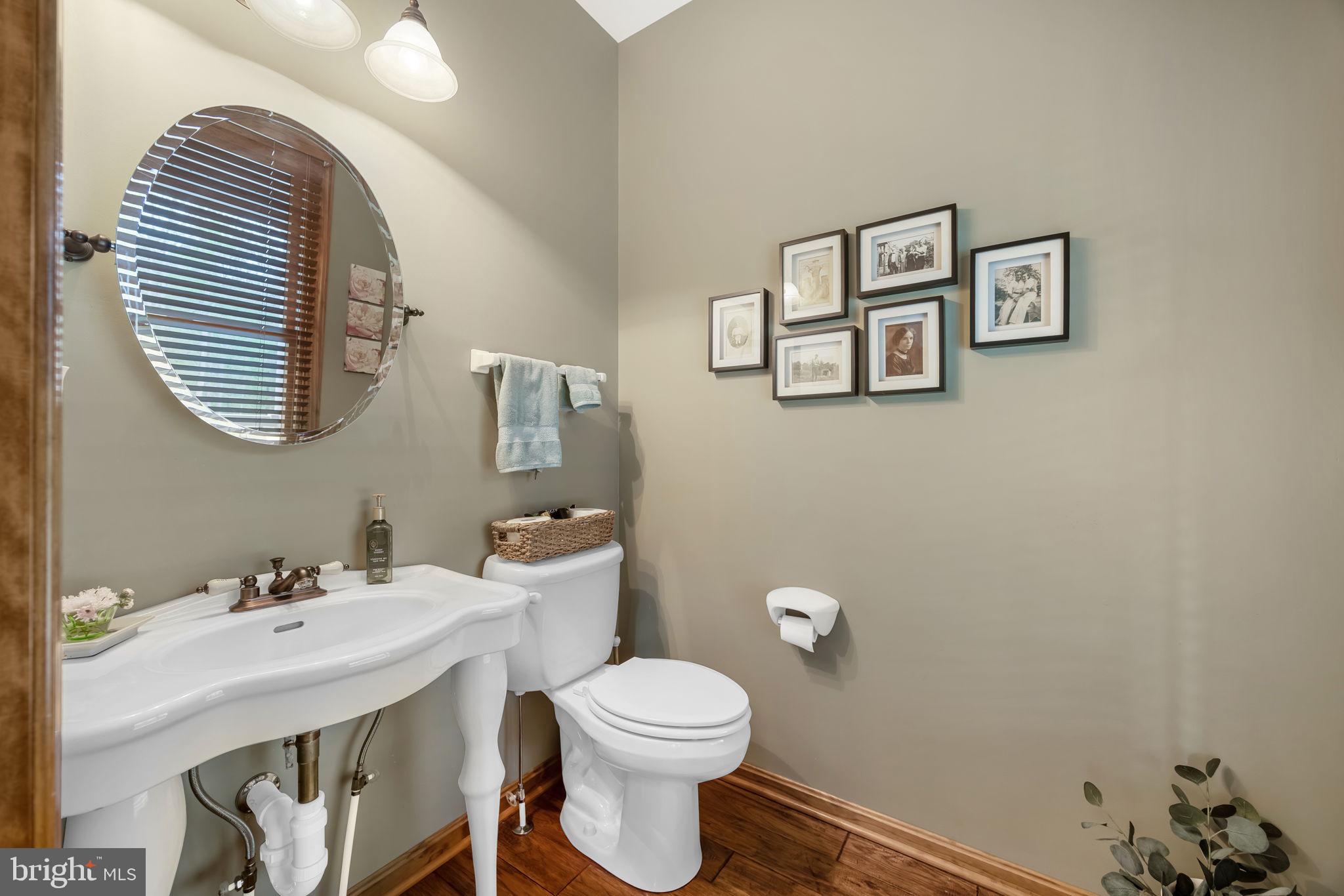 6657 Lawyers Road Spotsylvania, VA 22551 - Photo 24 of 73 a bathroom with a sink mirror and toilet