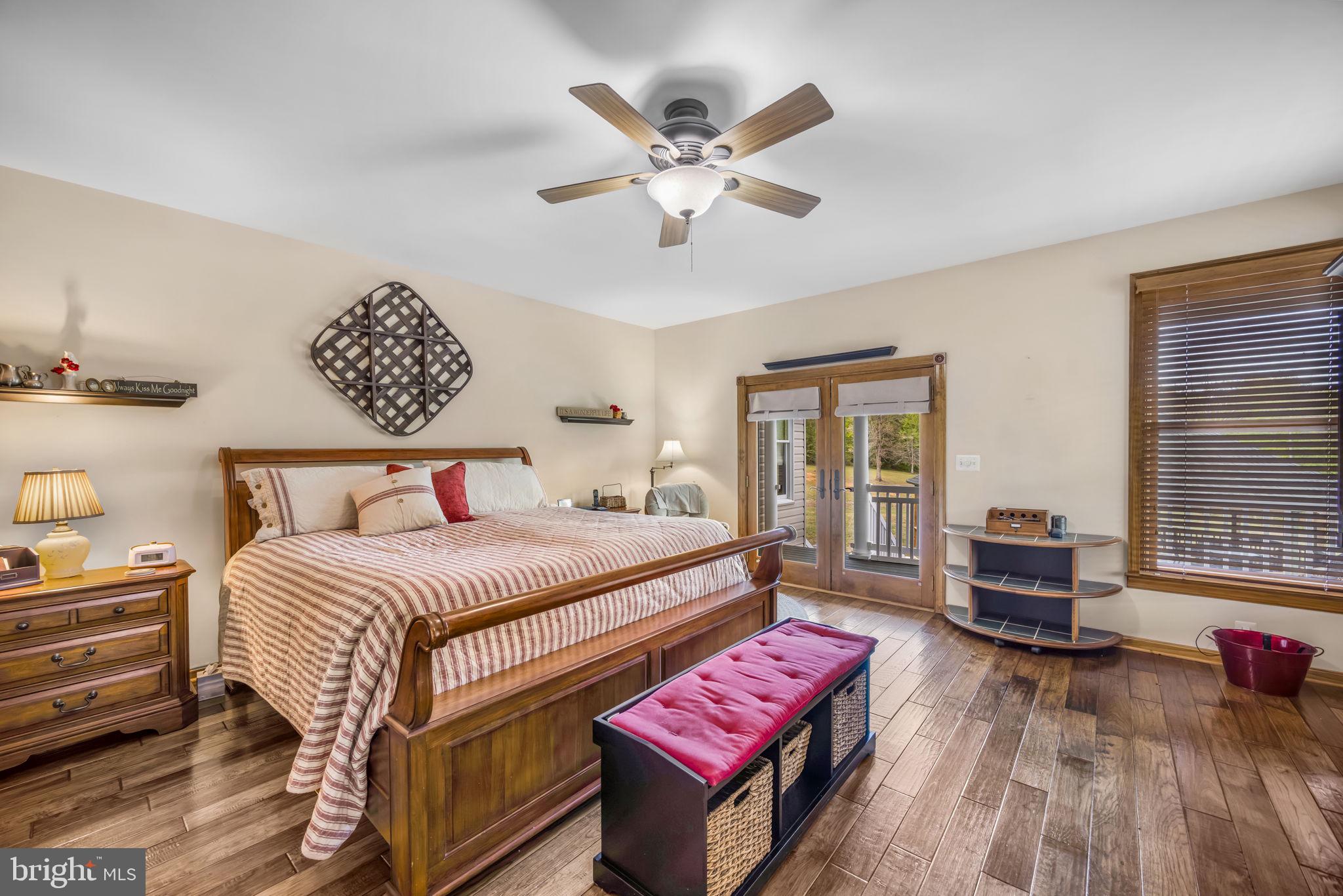 6657 Lawyers Road Spotsylvania, VA 22551 - Photo 26 of 73 a bedroom with a bed and wooden floor