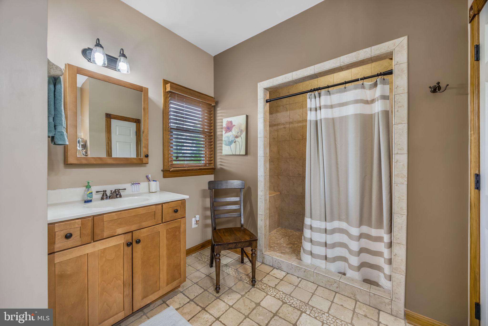 6657 Lawyers Road Spotsylvania, VA 22551 - Photo 30 of 73 a bathroom with a sink a toilet and a mirror