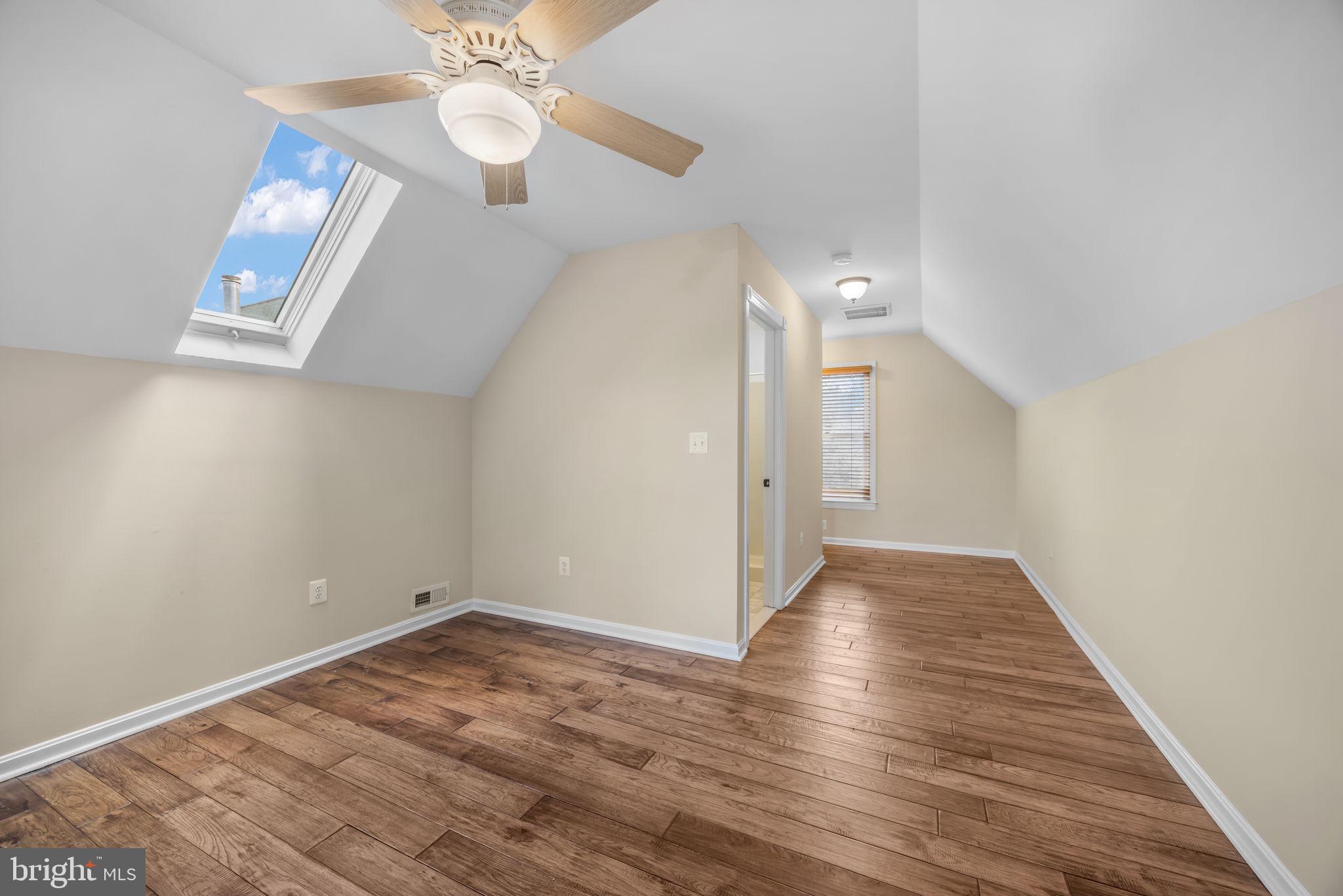 6657 Lawyers Road Spotsylvania, VA 22551 - Photo 45 of 73 an empty room with wooden floor fan and windows