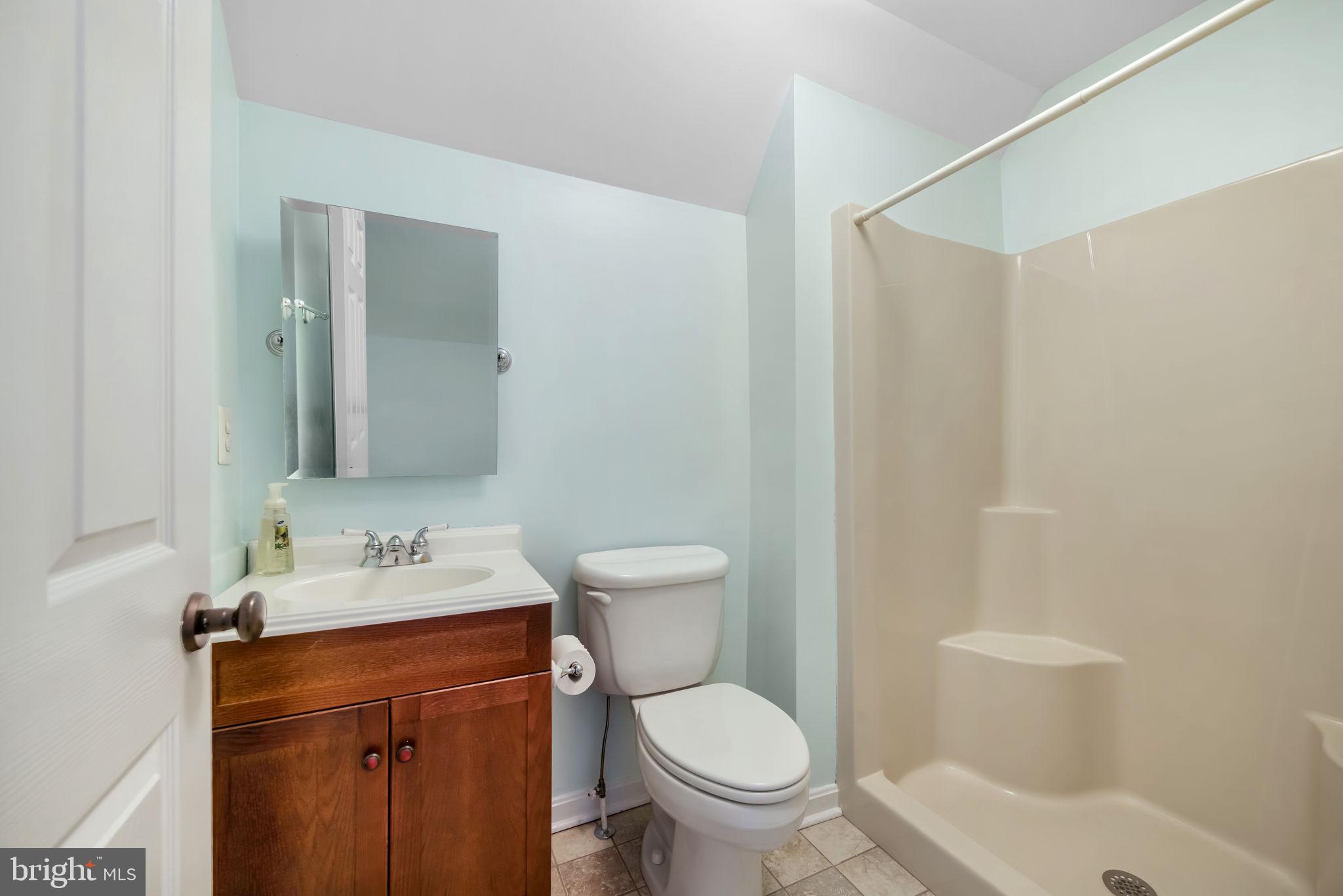 6657 Lawyers Road Spotsylvania, VA 22551 - Photo 46 of 73 a bathroom with a sink toilet and shower