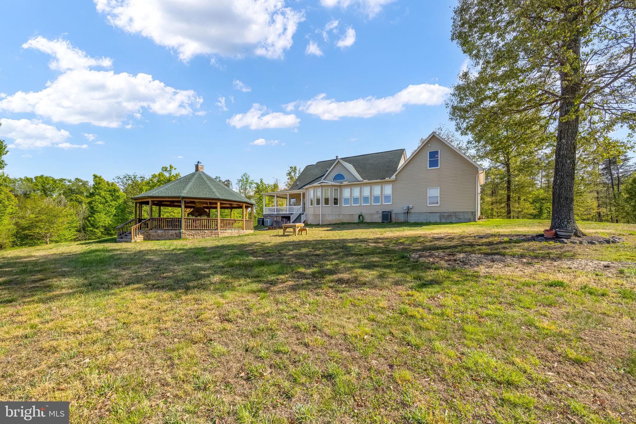 6657 Lawyers Road Spotsylvania, VA 22551 - Photo 57 of 73 a front view of a house with garden