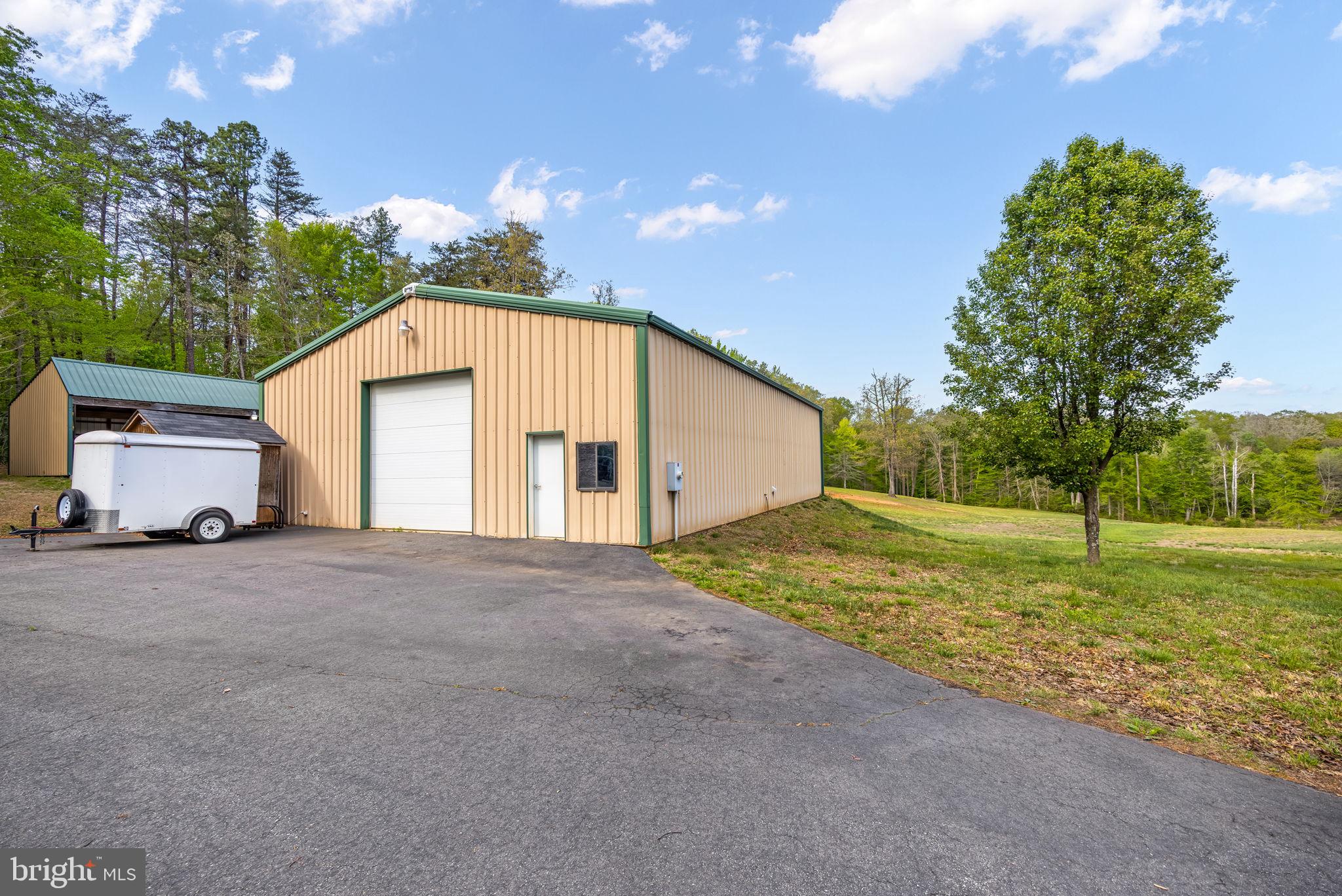 6657 Lawyers Road Spotsylvania, VA 22551 - Photo 65 of 73 a view of a house with backyard and trees