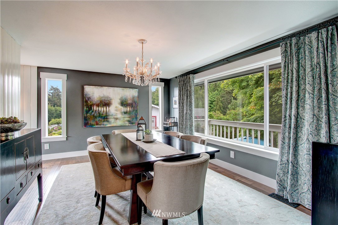 8604 Talbot Road Edmonds, WA 98026 - Photo 8 of 34 a dining room with furniture a chandelier and wooden floor