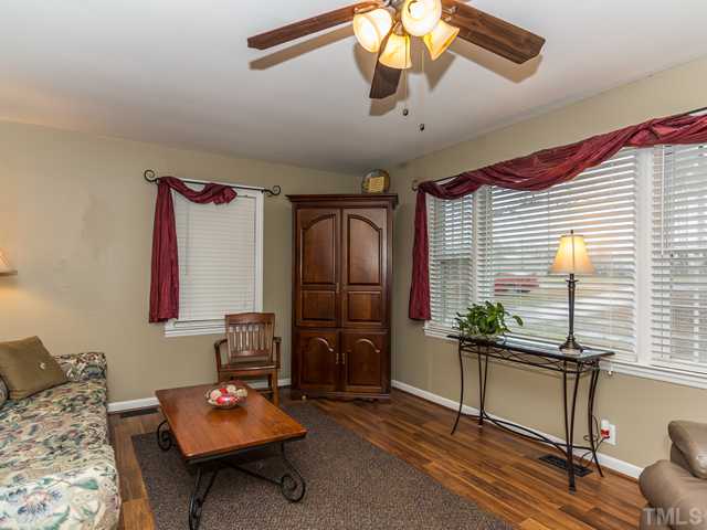 4605 Inwood Road Raleigh, NC 27603 - Photo 3 of 19 Big picture window in the living room allows plenty of natural light!