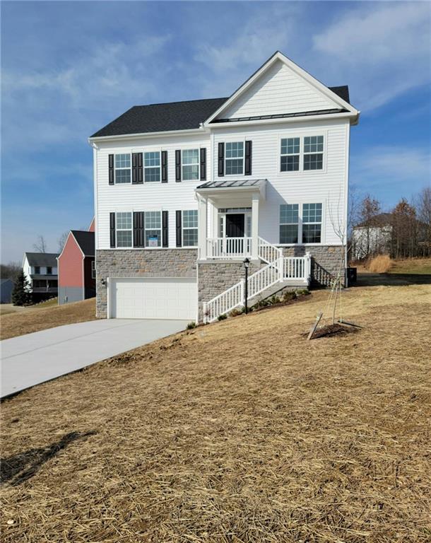 236 Wyncrest Drive Butler, PA 16001 - Photo 2 of 23 a front view of a house with a yard