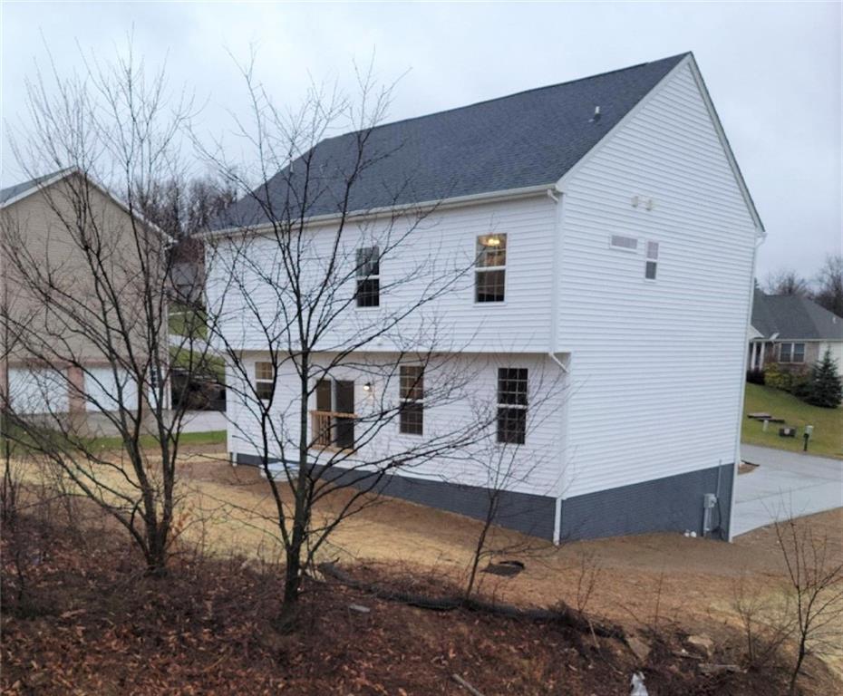 236 Wyncrest Drive Butler, PA 16001 - Photo 21 of 23 a view of a white house with large trees