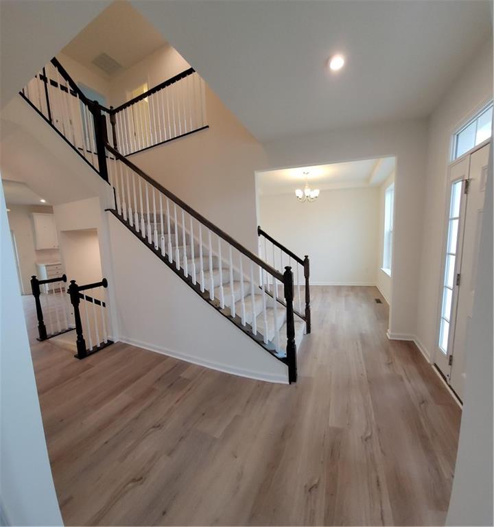 236 Wyncrest Drive Butler, PA 16001 - Photo 3 of 23 a view of entryway and hall with wooden floor
