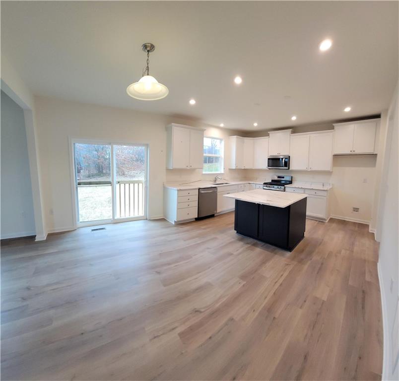 236 Wyncrest Drive Butler, PA 16001 - Photo 5 of 23 a large kitchen with stainless steel appliances granite countertop a large counter top and a wooden floors