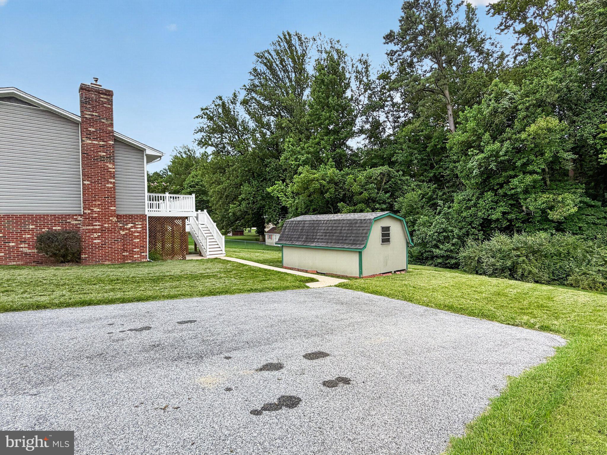 30075 Huntt Road Mechanicsville, MD 20659 - Photo 8 of 21 Spacious yard with lush greenery.
