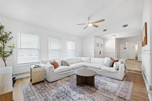 a living room with furniture and a large window