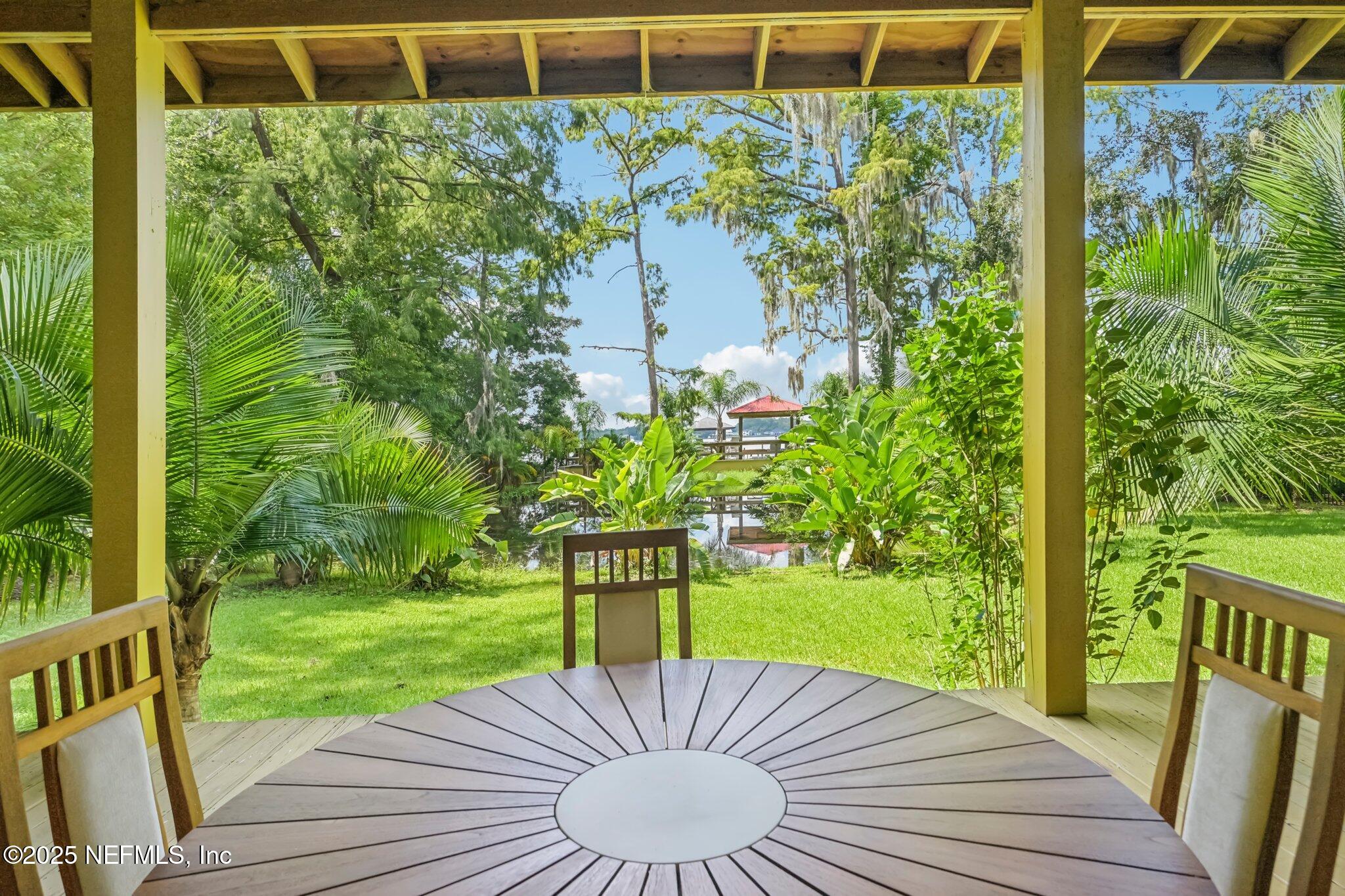 2778 Holly Point Road West Orange Park, FL 32073 - Photo 11 of 68 a view of a porch with furniture and garden