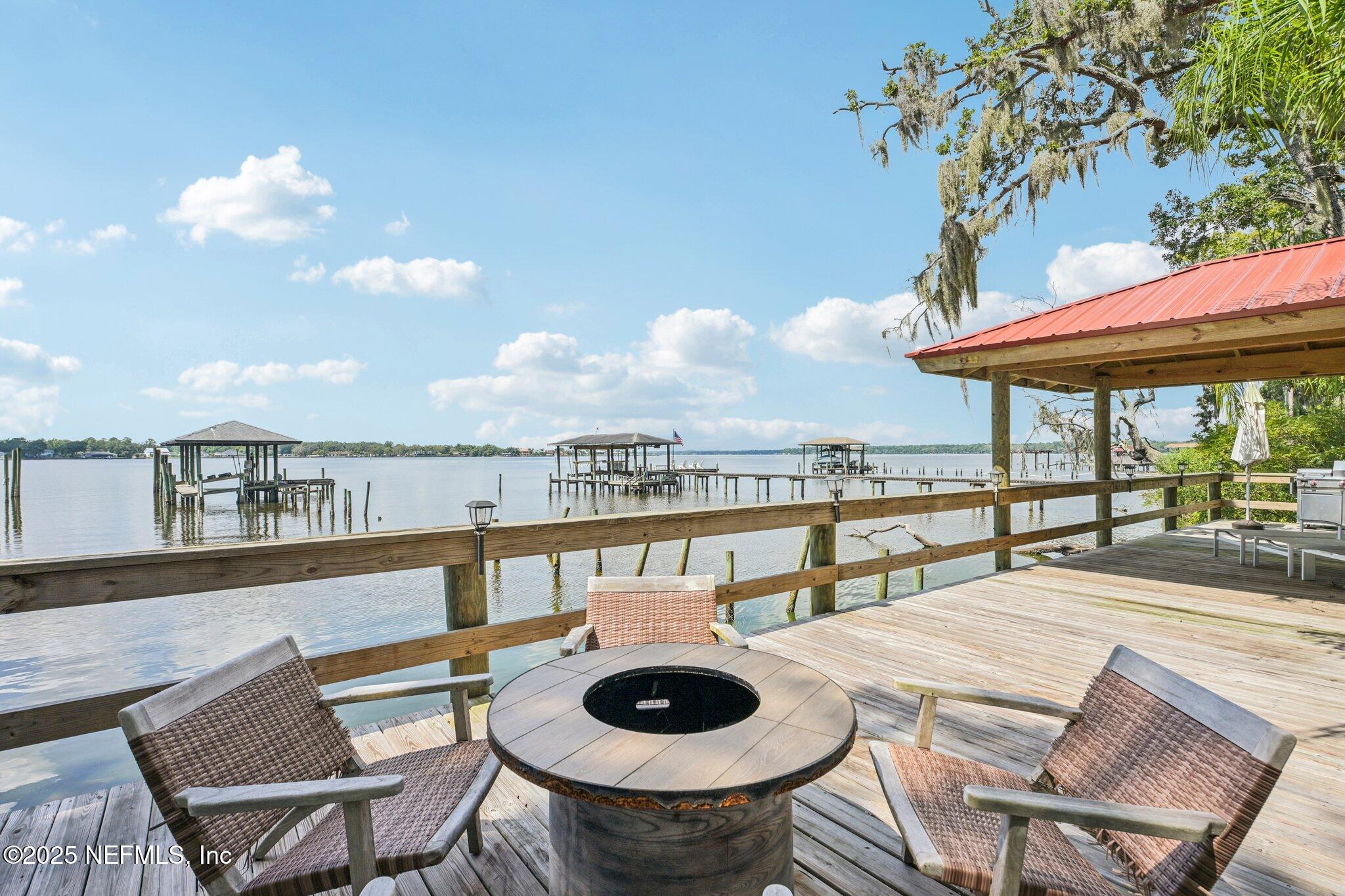2778 Holly Point Road West Orange Park, FL 32073 - Photo 15 of 68 a view of a balcony with table and chairs