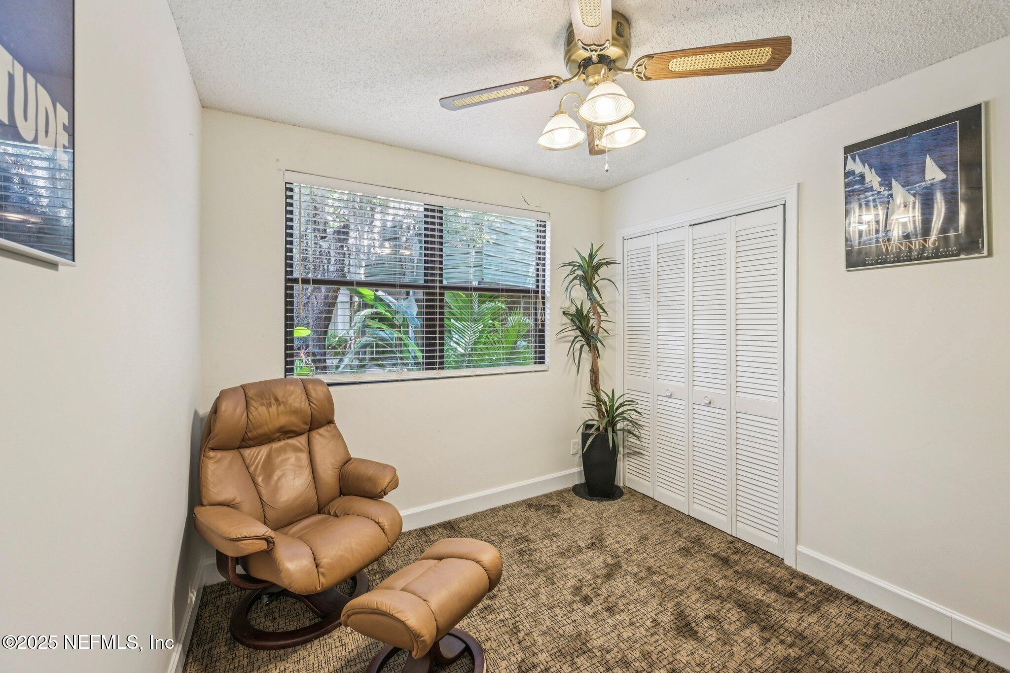 2778 Holly Point Road West Orange Park, FL 32073 - Photo 39 of 68 a living room with furniture and a large window
