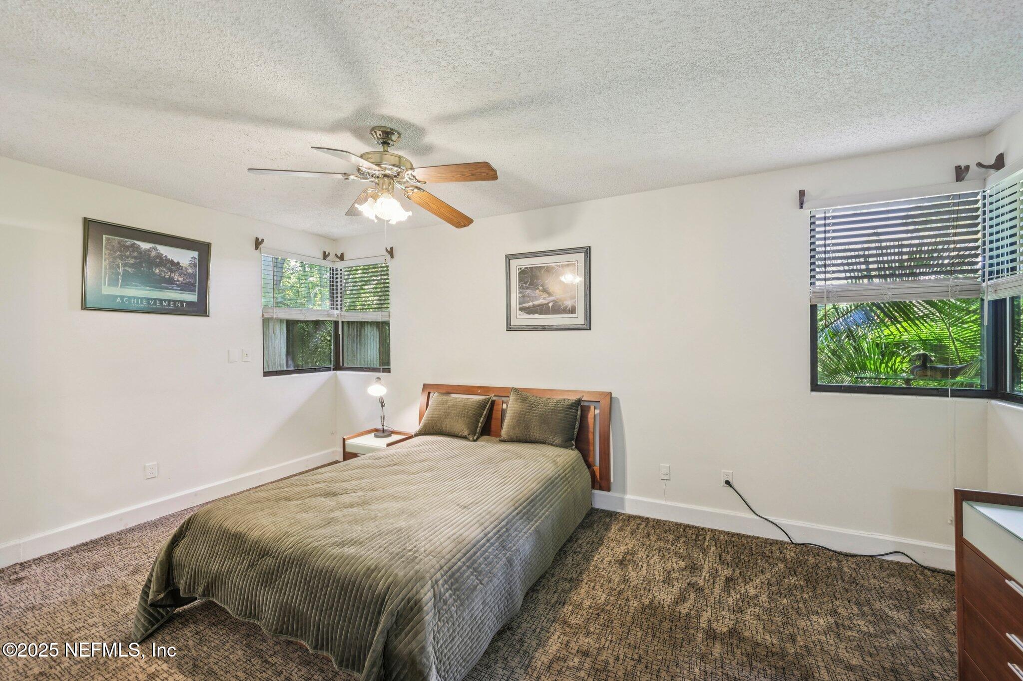 2778 Holly Point Road West Orange Park, FL 32073 - Photo 43 of 68 a bedroom with a bed and a window