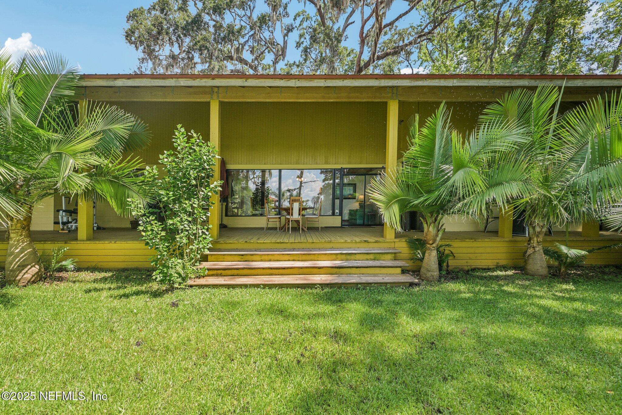 2778 Holly Point Road West Orange Park, FL 32073 - Photo 53 of 68 a front view of a house with garden