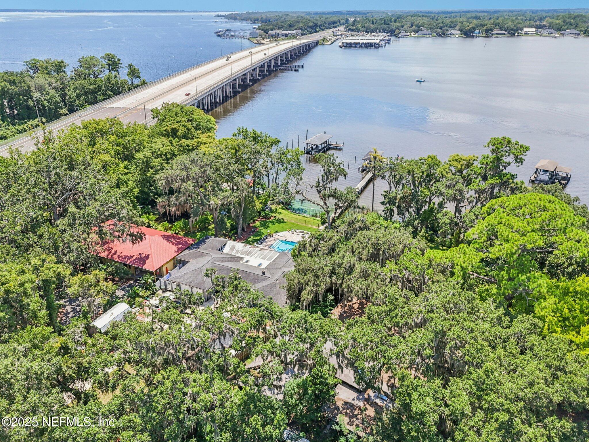 2778 Holly Point Road West Orange Park, FL 32073 - Photo 55 of 68 an aerial view of a house with a yard and lake view