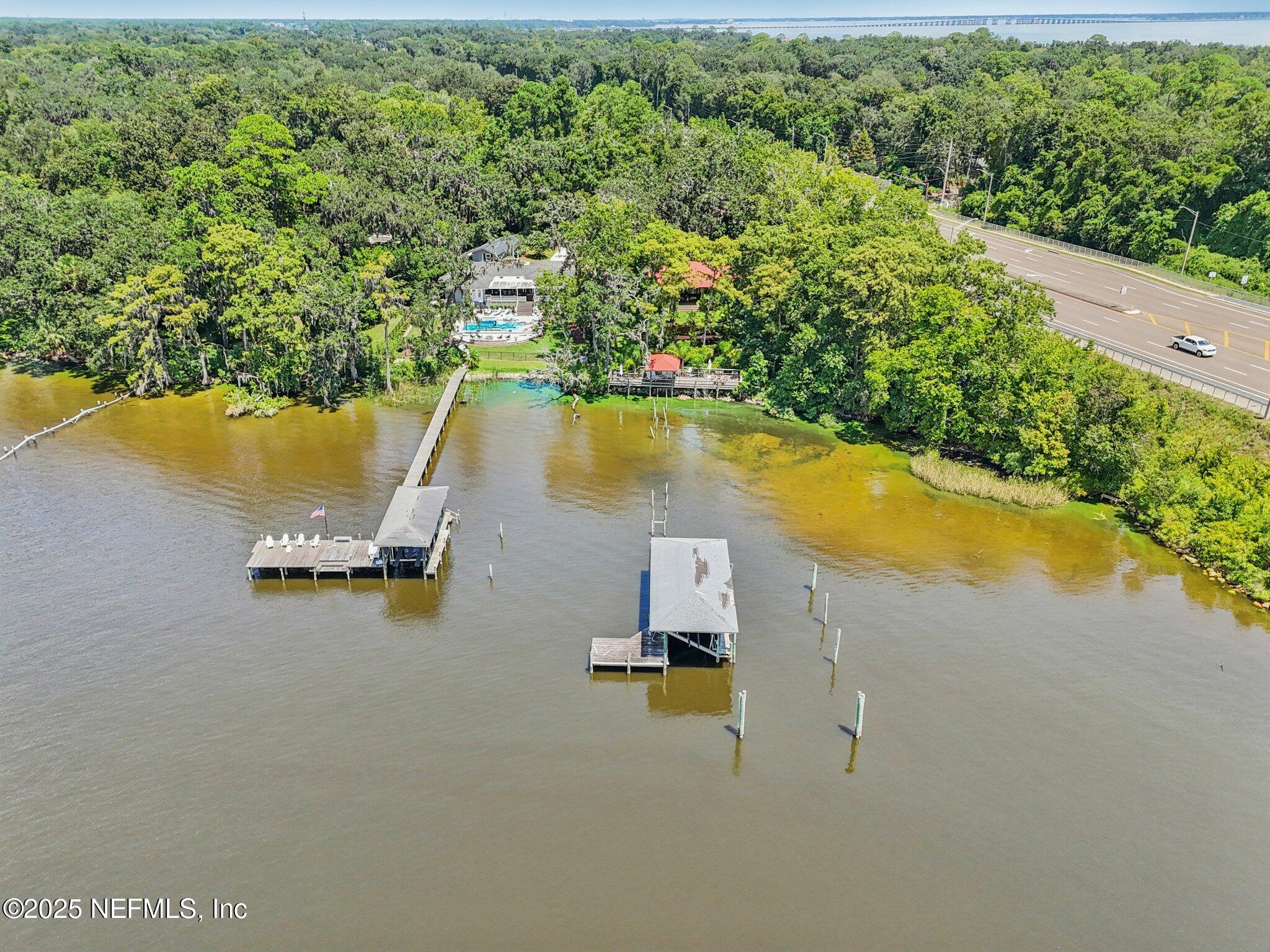2778 Holly Point Road West Orange Park, FL 32073 - Photo 56 of 68 an aerial view of residential houses with outdoor space and swimming pool