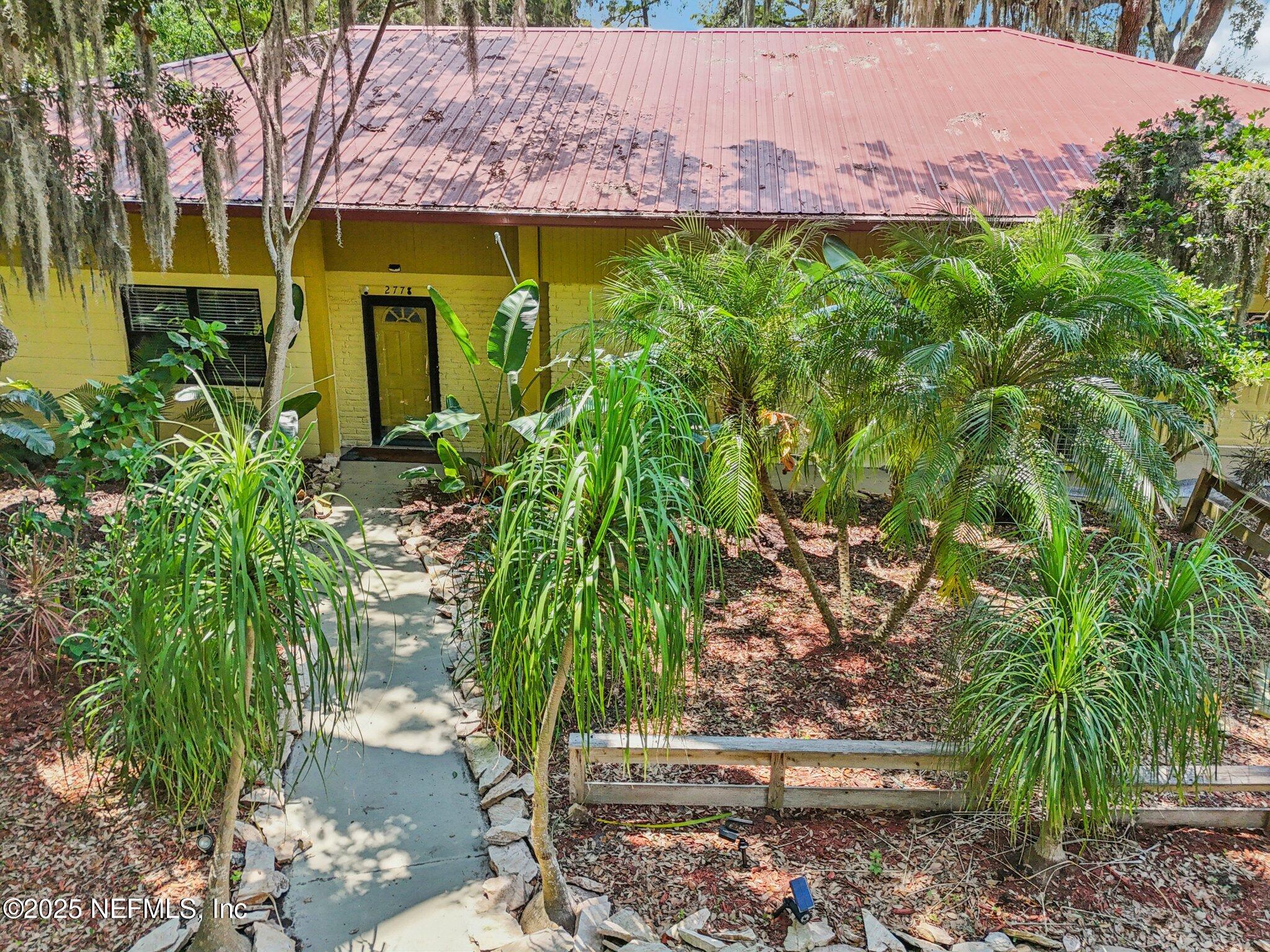 2778 Holly Point Road West Orange Park, FL 32073 - Photo 59 of 68 a view of a garden with plants