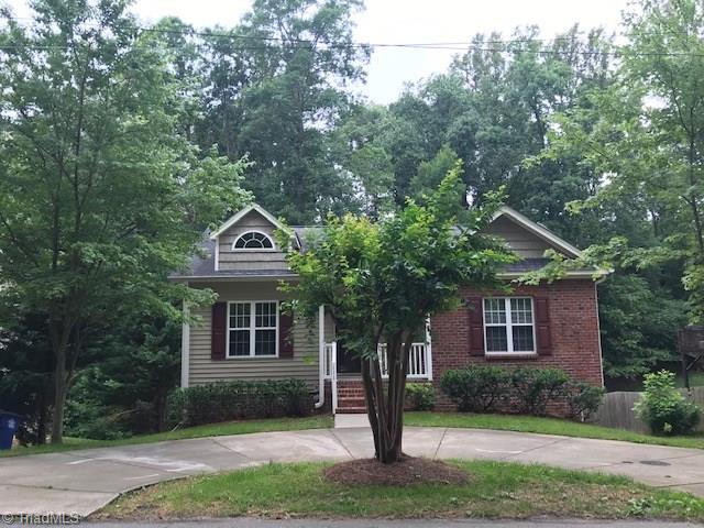 111 Powers Road Winston-Salem, NC 27106 - Photo 1 of 22 WELCOME HOME-circle drive, front porch, and mature landscaping make a beautiful home