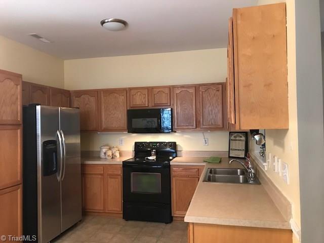 111 Powers Road Winston-Salem, NC 27106 - Photo 2 of 22 Bright and roomy kitchen with an adjacent dining area - efficient and functional design makes it easy for everyday meals or entertaining with cookouts
