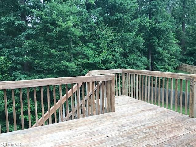 111 Powers Road Winston-Salem, NC 27106 - Photo 19 of 22 Walk out the kitchen/breakfast room door onto your spacious deck overlooking a private backyard