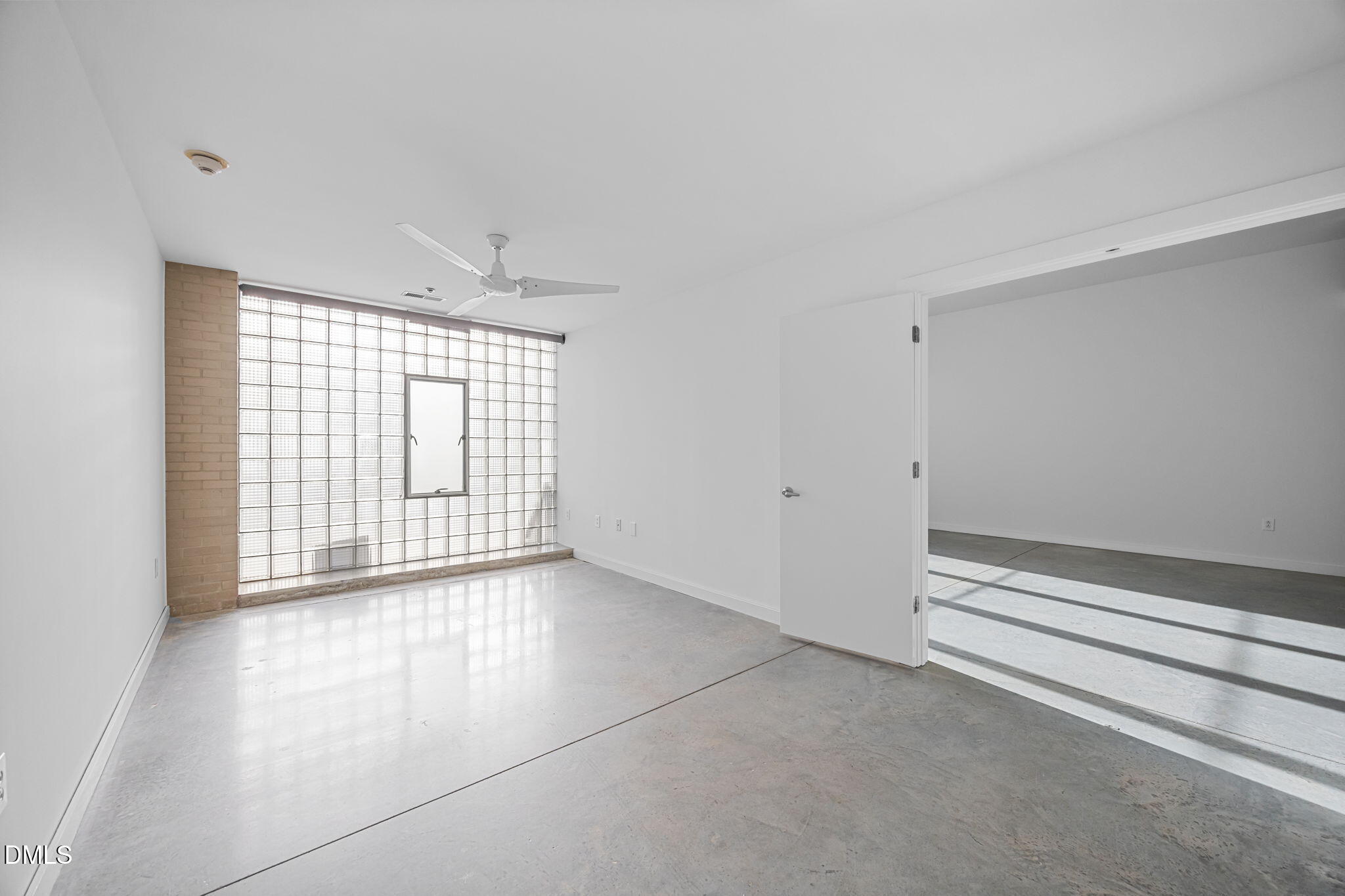 319 Fayetteville Street, Unit 210 Raleigh, NC 27601 - Photo 22 of 61 a view of an empty room with a window