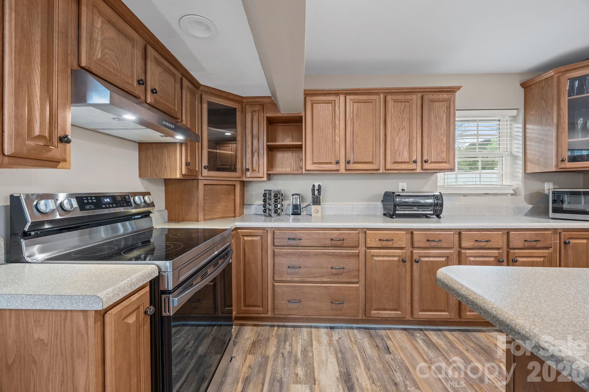 1870 Scout Road Salisbury, NC 28146 - Photo 22 of 48 a kitchen with stainless steel appliances granite countertop a sink and cabinets