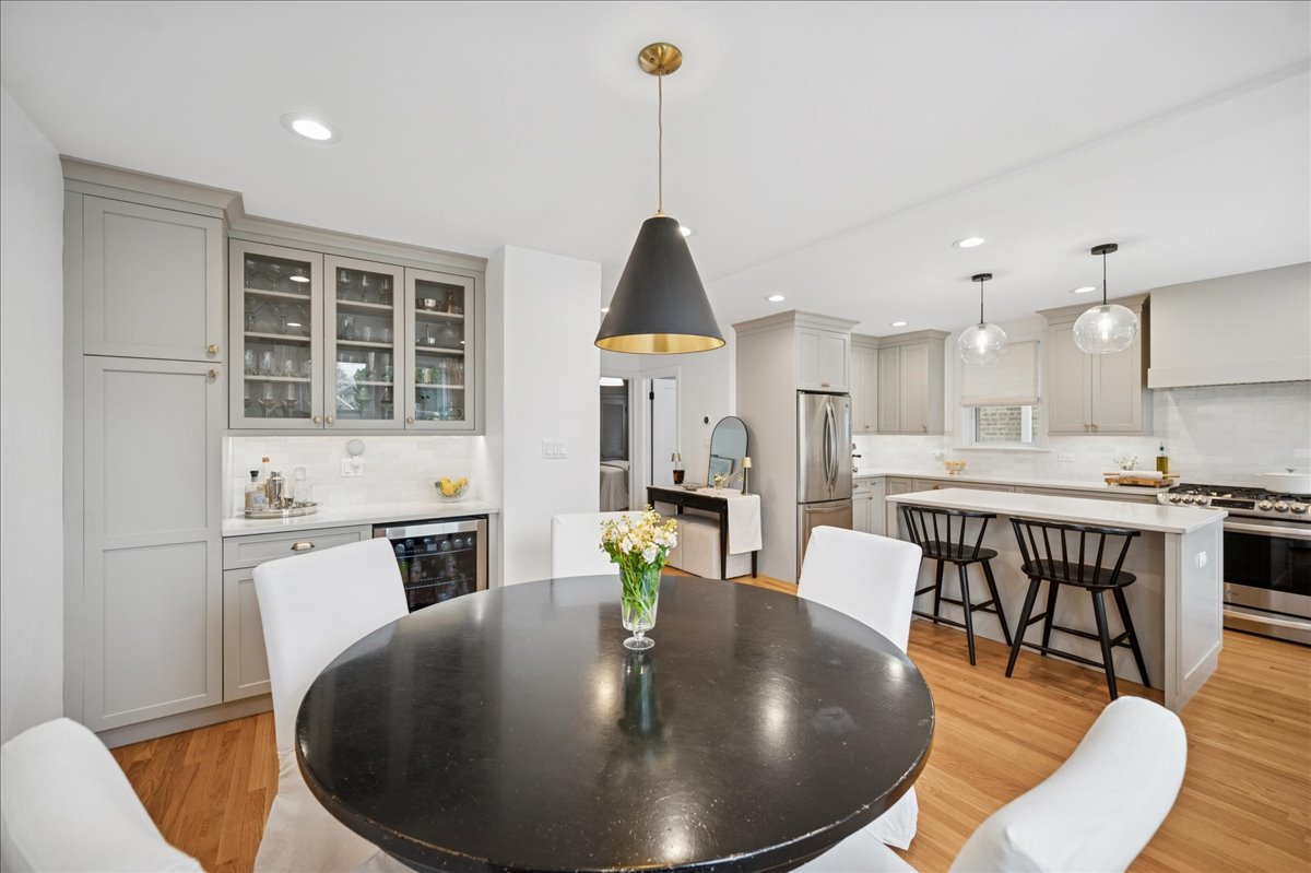 821 Lathrop Avenue Forest Park, IL 60130 - Photo 14 of 38 a living room with stainless steel appliances furniture a dining table and kitchen view