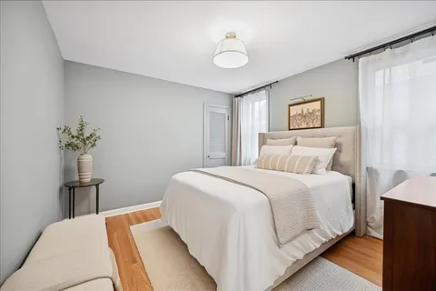 a bedroom with a bed and a table in it