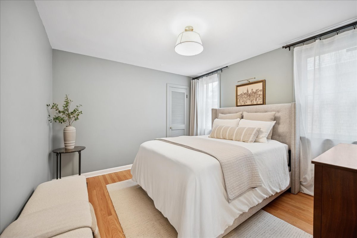 821 Lathrop Avenue Forest Park, IL 60130 - Photo 15 of 38 a bedroom with a bed and a table in it