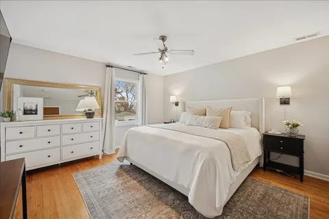 a bed room with a bed and a dresser
