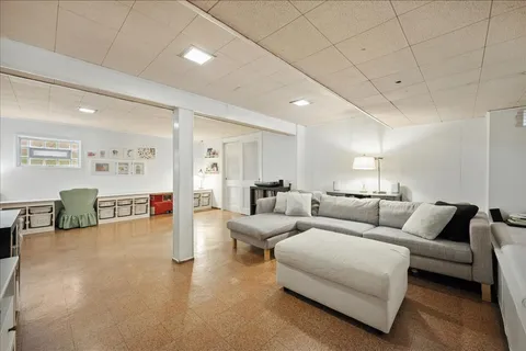 a living room with furniture and a table