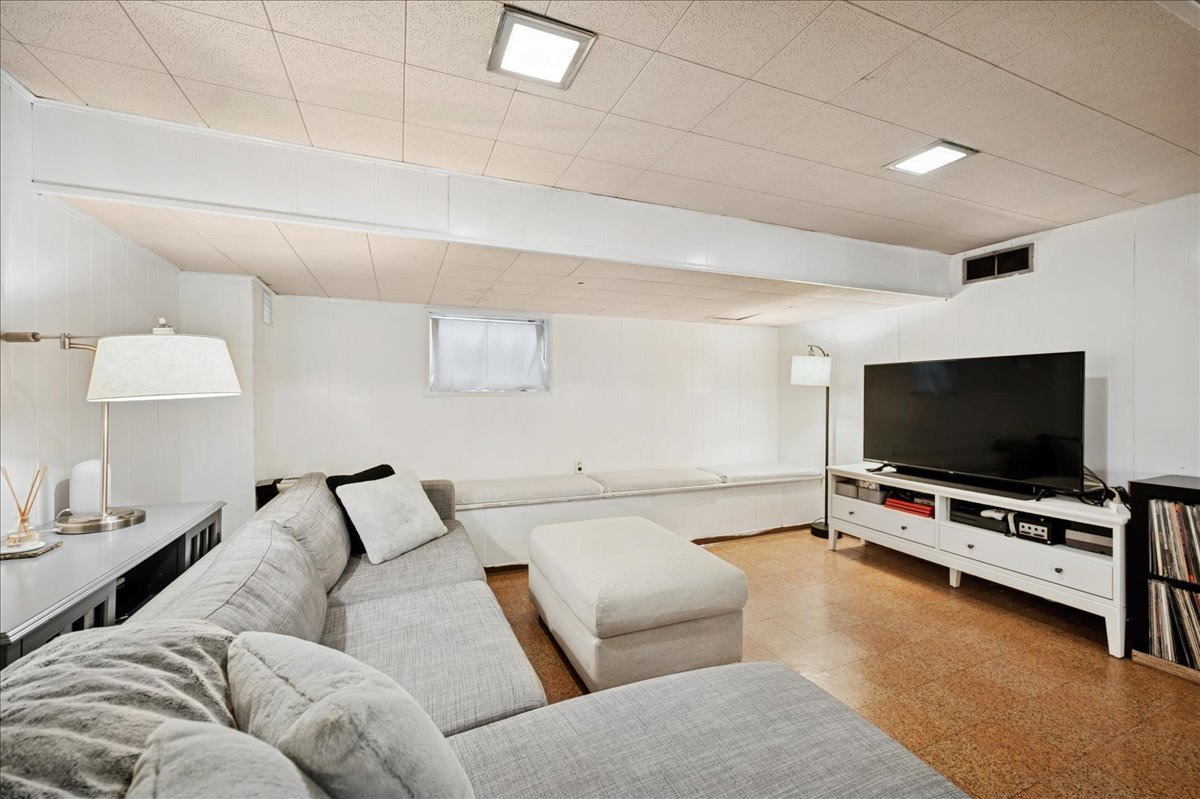 821 Lathrop Avenue Forest Park, IL 60130 - Photo 26 of 38 a living room with furniture and a flat screen tv