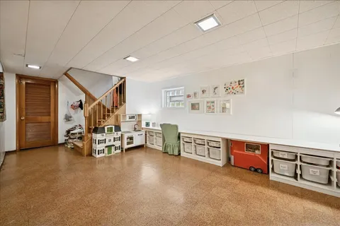 a view of a livingroom with furniture and white walls