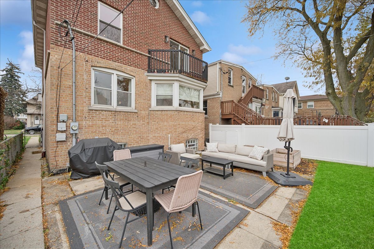 821 Lathrop Avenue Forest Park, IL 60130 - Photo 30 of 38 a view of a patio with a table and chairs