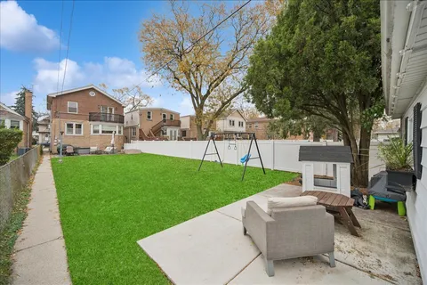 a view of a house with a yard porch and sitting area