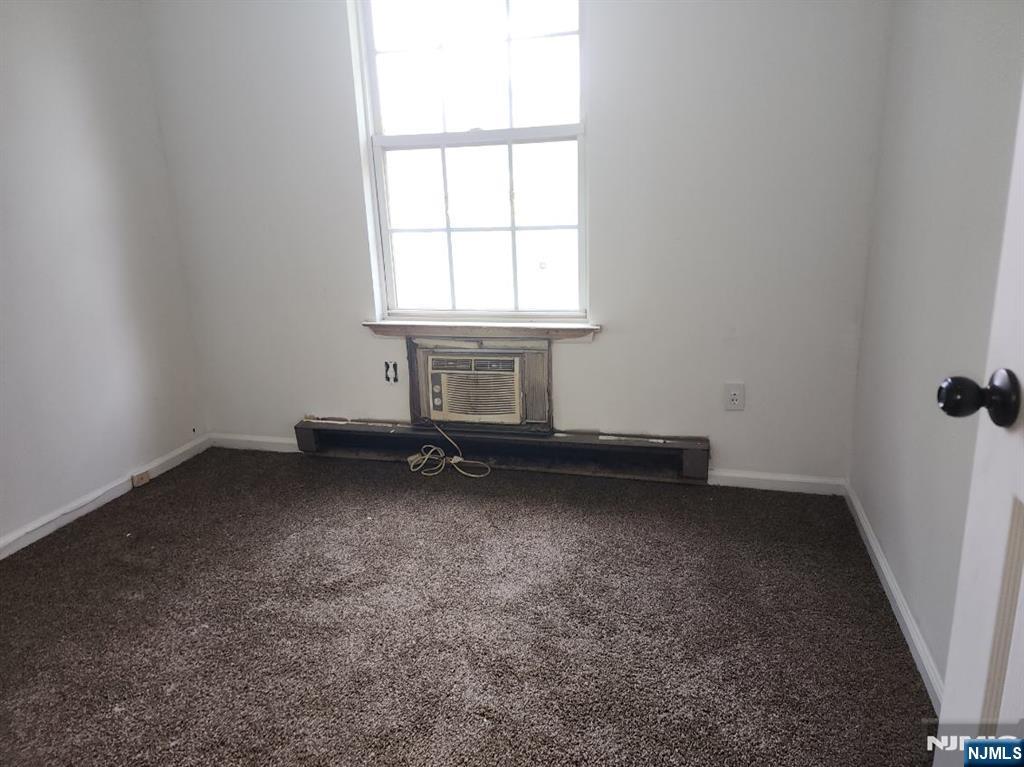 107 Chatfield Drive Pompton Plains, NJ 07444 - Photo 2 of 4 an empty room with a window