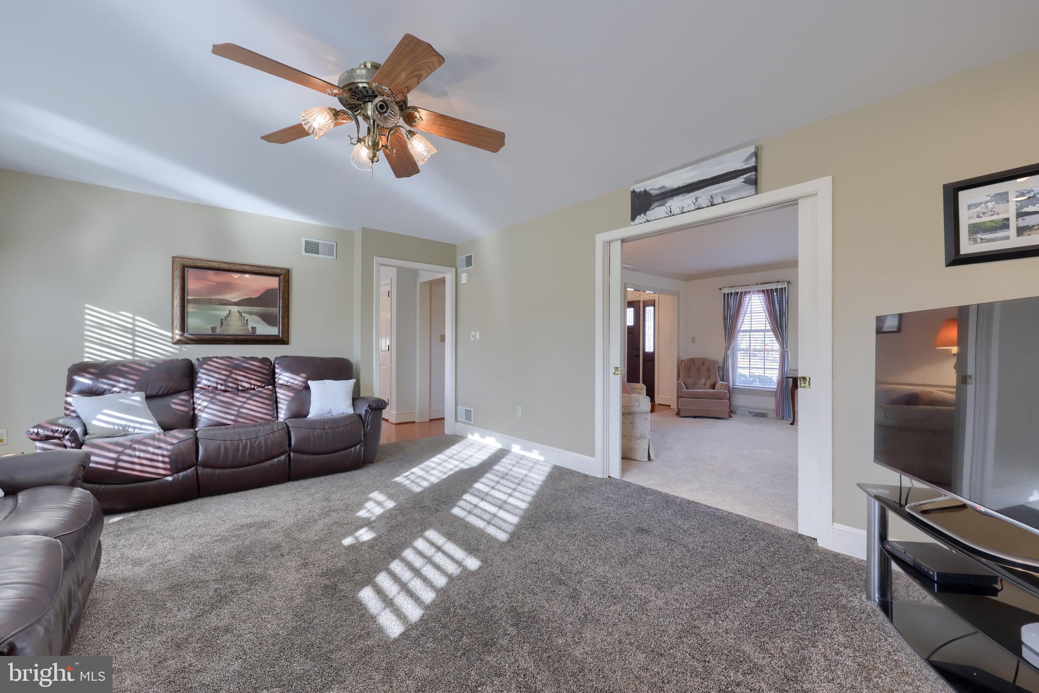 128 Hammersmith Lane Lititz, PA 17543 - Photo 12 of 65 a living room with furniture and a flat screen tv