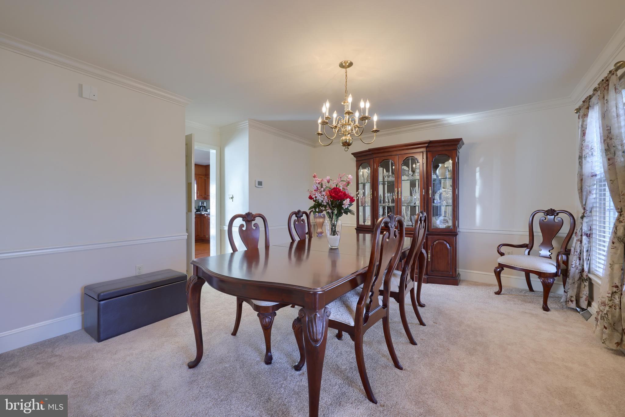 128 Hammersmith Lane Lititz, PA 17543 - Photo 17 of 65 a view of a dining room with furniture and chandelier