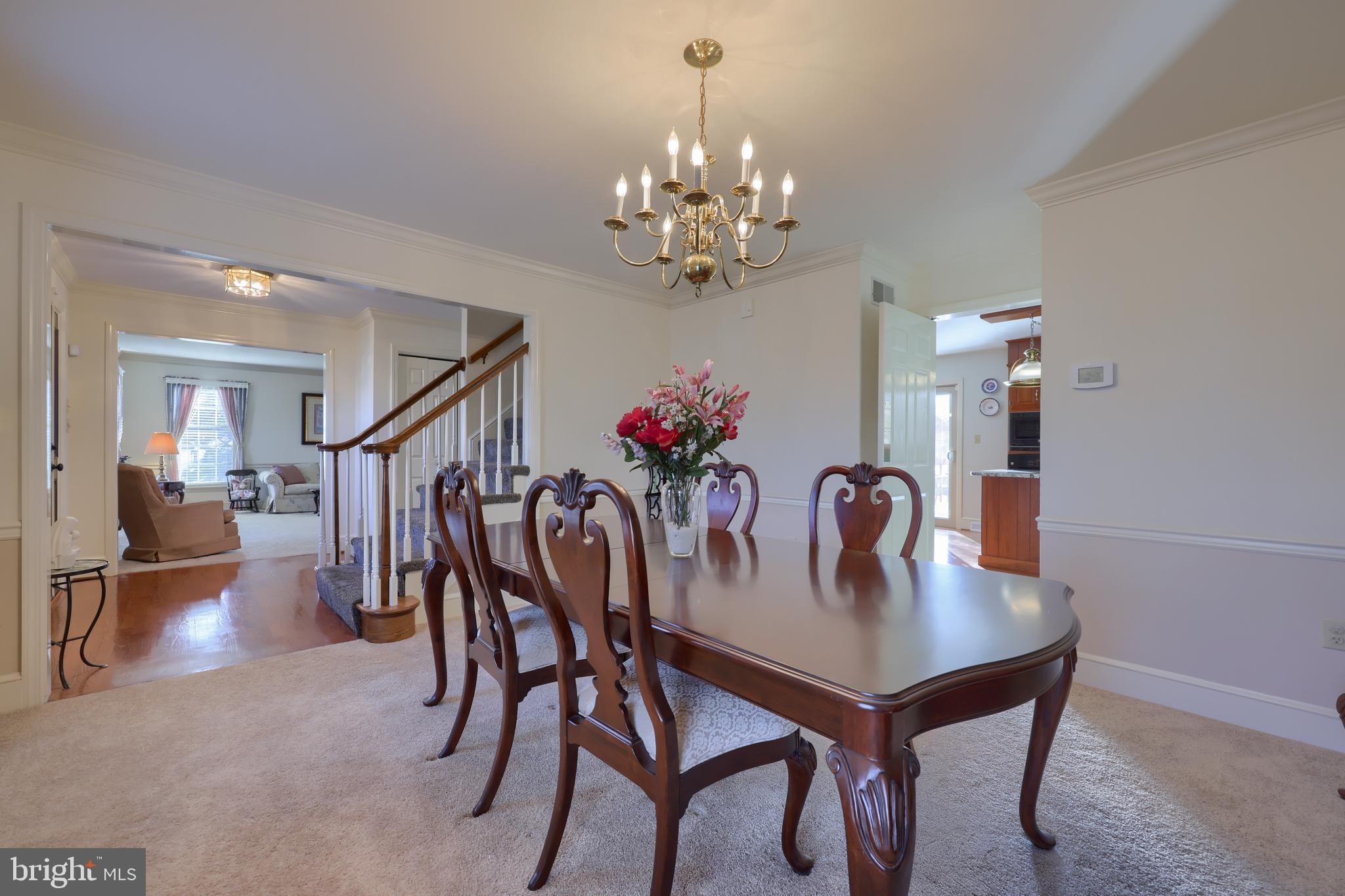128 Hammersmith Lane Lititz, PA 17543 - Photo 18 of 65 a view of a dining room with furniture and chandelier