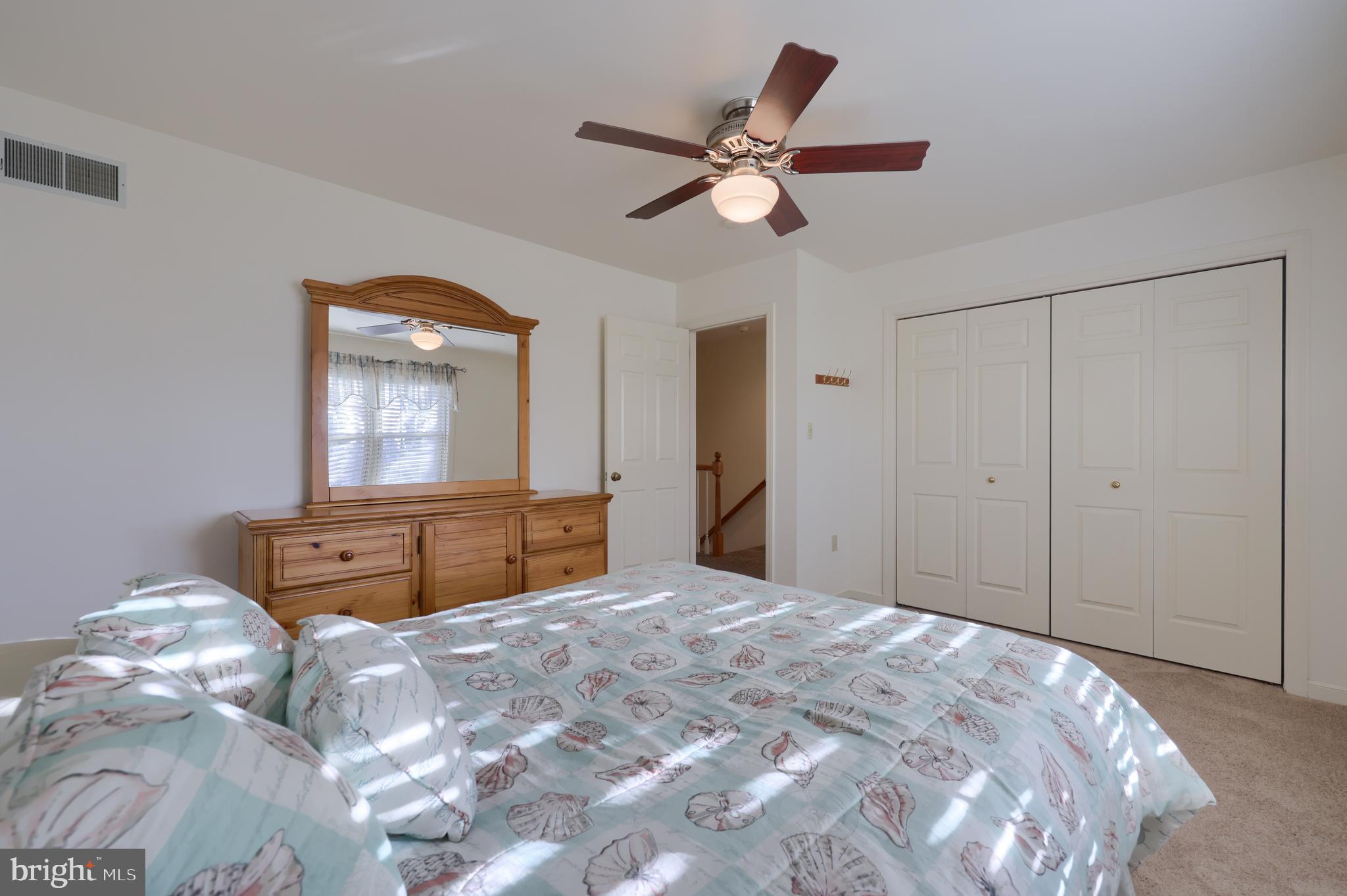 128 Hammersmith Lane Lititz, PA 17543 - Photo 38 of 65 a bedroom with a large bed and a chandelier